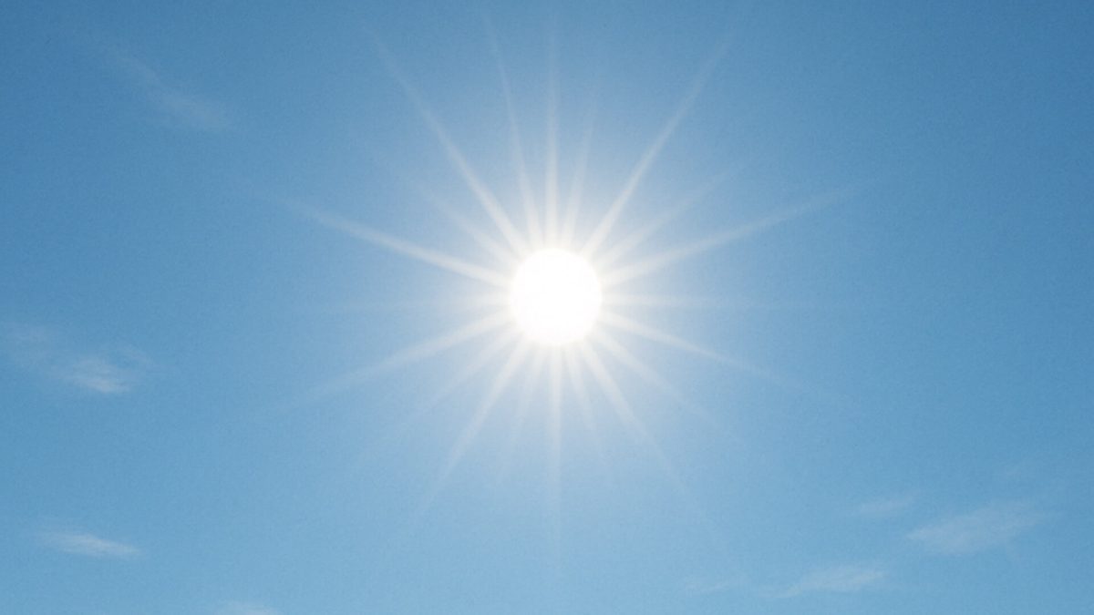 Midday sun in clear blue sky