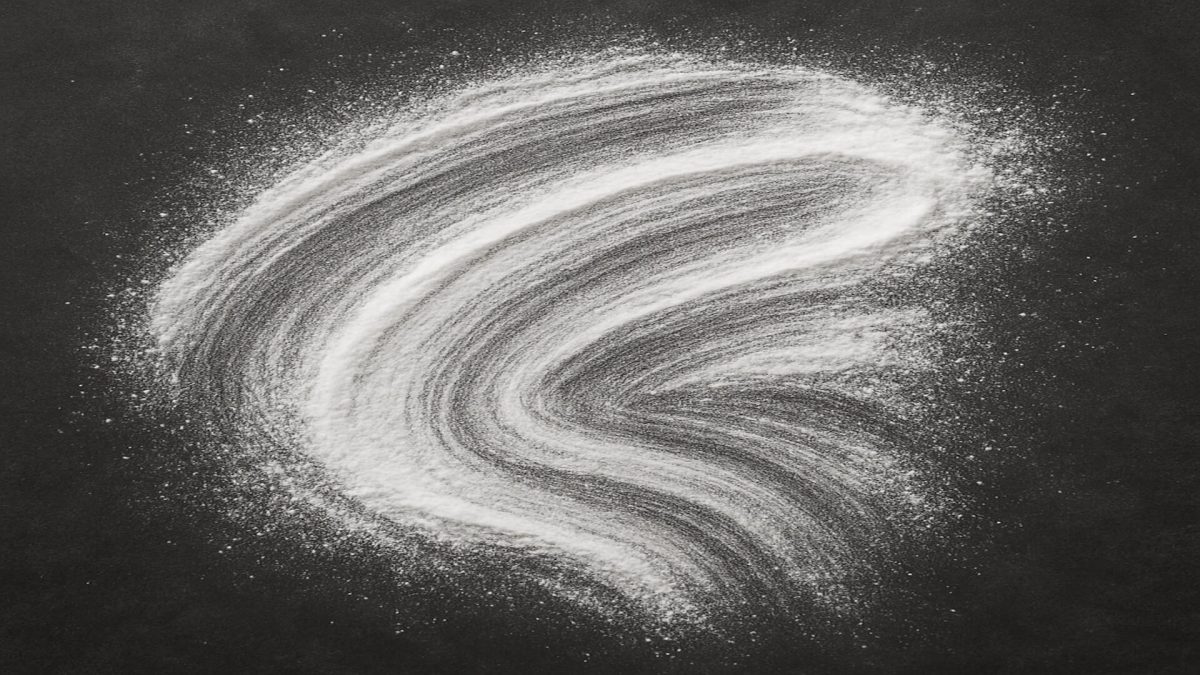 Raw azelaic acid powder brushed on dark plate